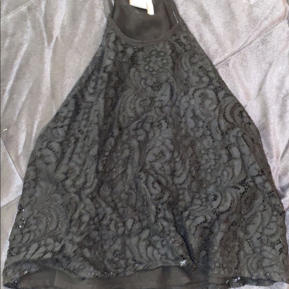 Black lacy flowy tank it’s a little cropped but not much